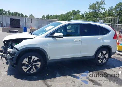 2015 Honda Cr-V Touring z USA, uszkodzony, nr VIN 5J6RM4H92FL116338